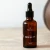 Yokaba Orange Oil 50 ml na beżowym blacie w ciepłym świetle, kadr w klimacie SPA