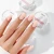 Candy Ivory Beige 50 g - swatch mleczno-beżowego żelu budującego kamuflaż na paznokciu