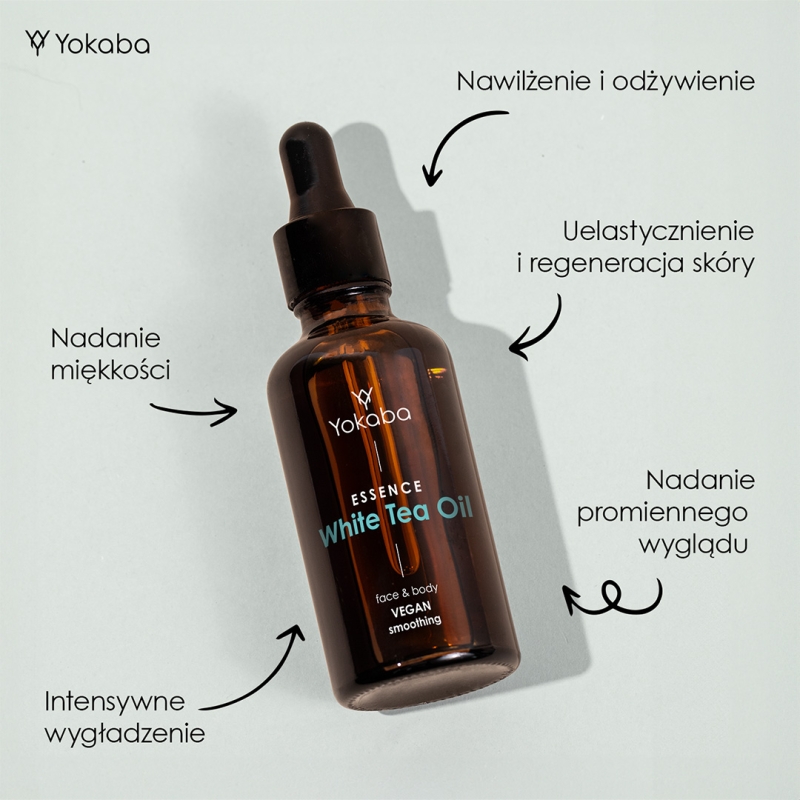 Butelka Yokaba White Tea Oil 50 ml leżąca na jasnym tle, wokół opisane działanie olejku: nawilżenie, wygładzenie, uelastycznienie i miękkość skóry