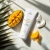 Krem Yokaba Mango&Coco w mniejszej tubie 75 ml wśród owoców mango i kawałków kokosa