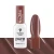Victoria Vynn Pure Vegan Creamy Hybrid nr 284 Nude Wood 8 ml, butelka obok paznokietnika z jasnobrązowym lakierem