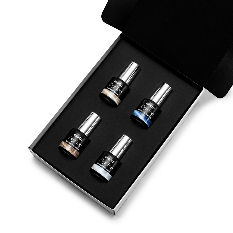 Elarto Zestaw topów kocie oko i holo Catlight 4 x 7ml - otwarte czarne pudełko z czterema butelkami topów Dry Top Catlight