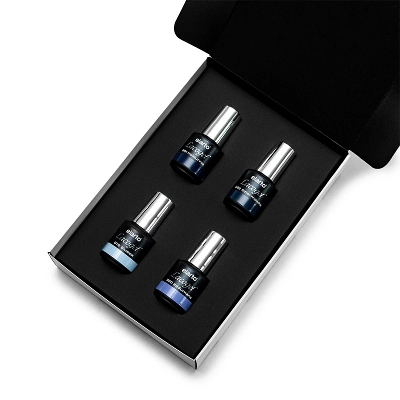 Elarto Zestaw 4 lakierów hybrydowych Lacogel Blue Story odcienie niebieskiego 4x7ml - otwarte czarne pudełko z czterema butelkami lakierów Lacogel Blue Story