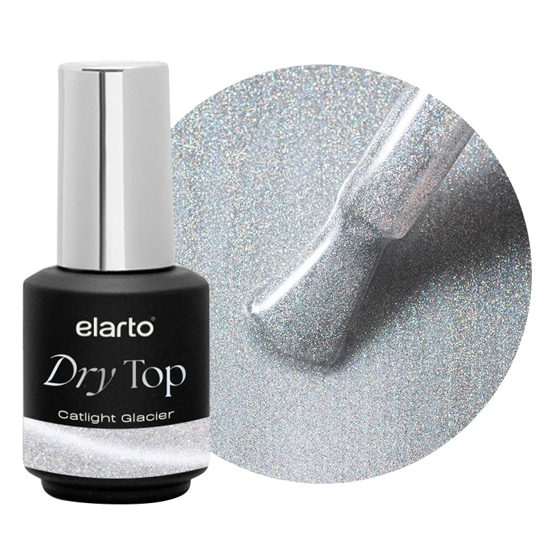 Elarto Top kocie oko i holo w jednym Catlight Glacier 7ml - czarna butelka Dry Top ze srebrną nakrętką obok okrągłego kadru z pędzelkiem w srebrnym topie z holograficznymi drobinami